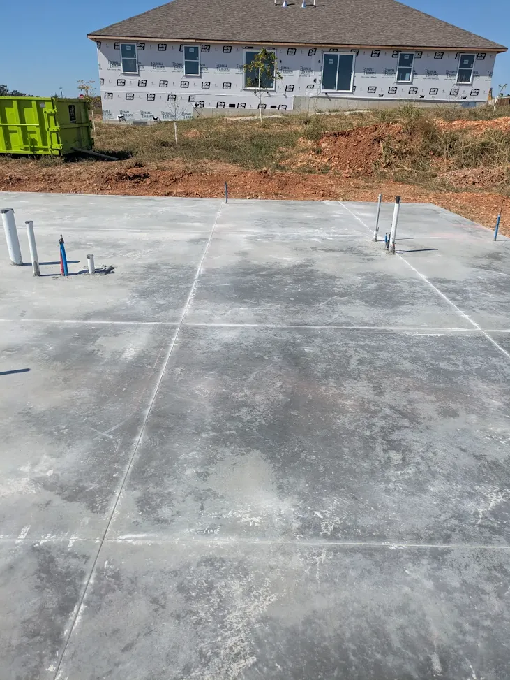 Concrete slab finish and control joints with plumbing stub-outs Concrete slab finish and control joints with plumbing stub-outs