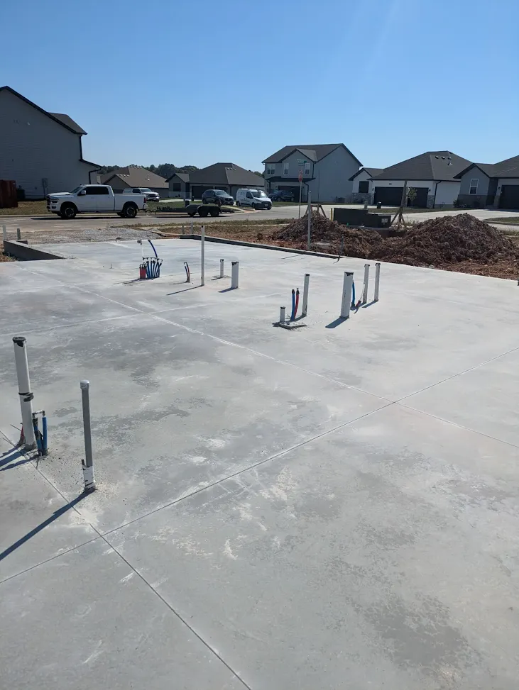 Residential concrete slab with plumbing rough-ins facing the street Residential concrete slab with plumbing rough-ins facing the street